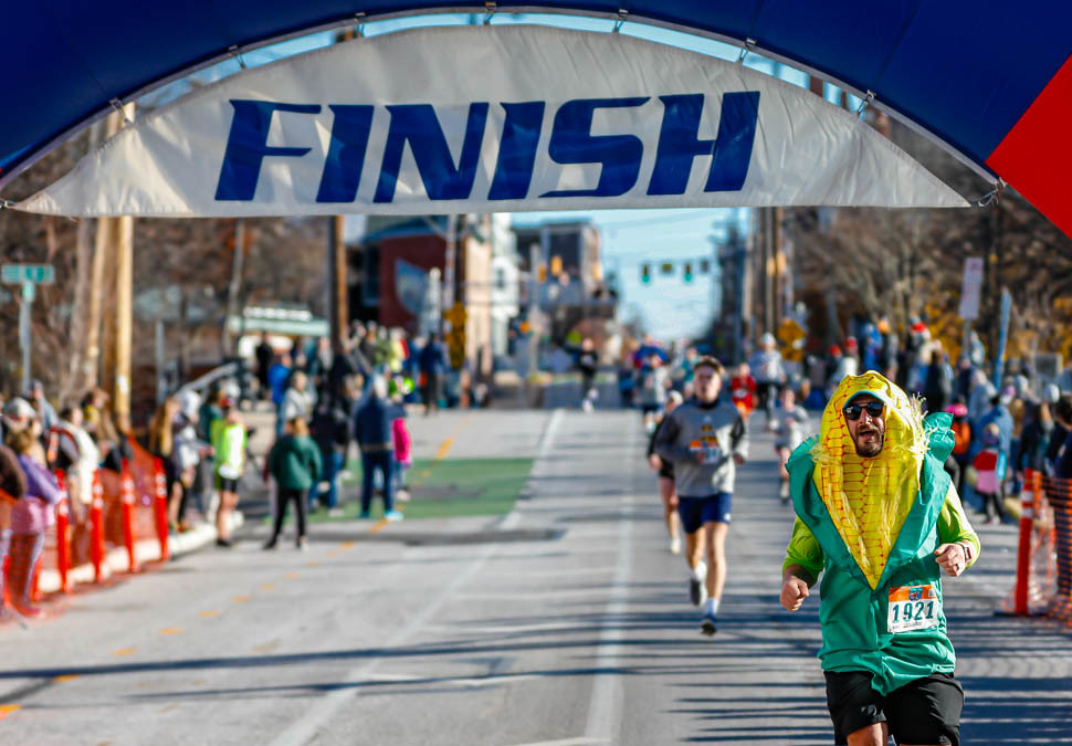 Me, dressed up as a piece of corn, crossing the finish line of the 2023 York Turkey Trot