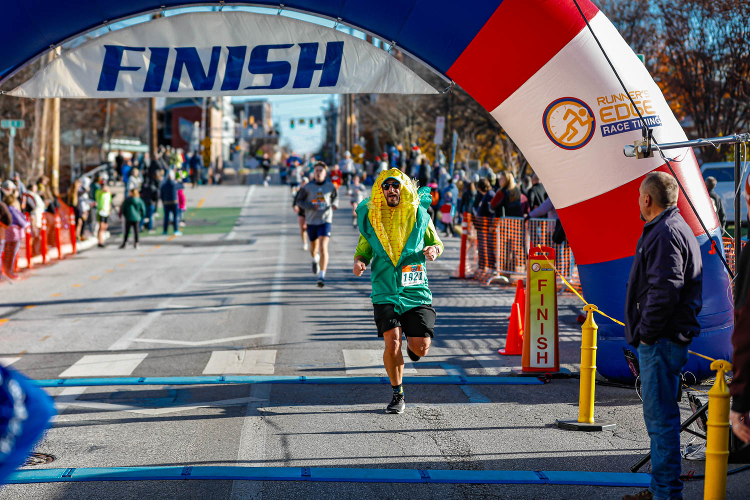 Crossing the finish line in my corn costume at the Turkey Trot